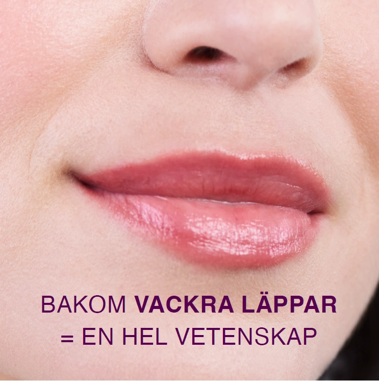 En närbild av en kvinnas läppar med ljusrosa läppstift. Den svenska texten på bilden lyder "Bakom vackra läppar = en hel vetenskap", vilket betyder "Bakom vackra läppar = en hel vetenskap".